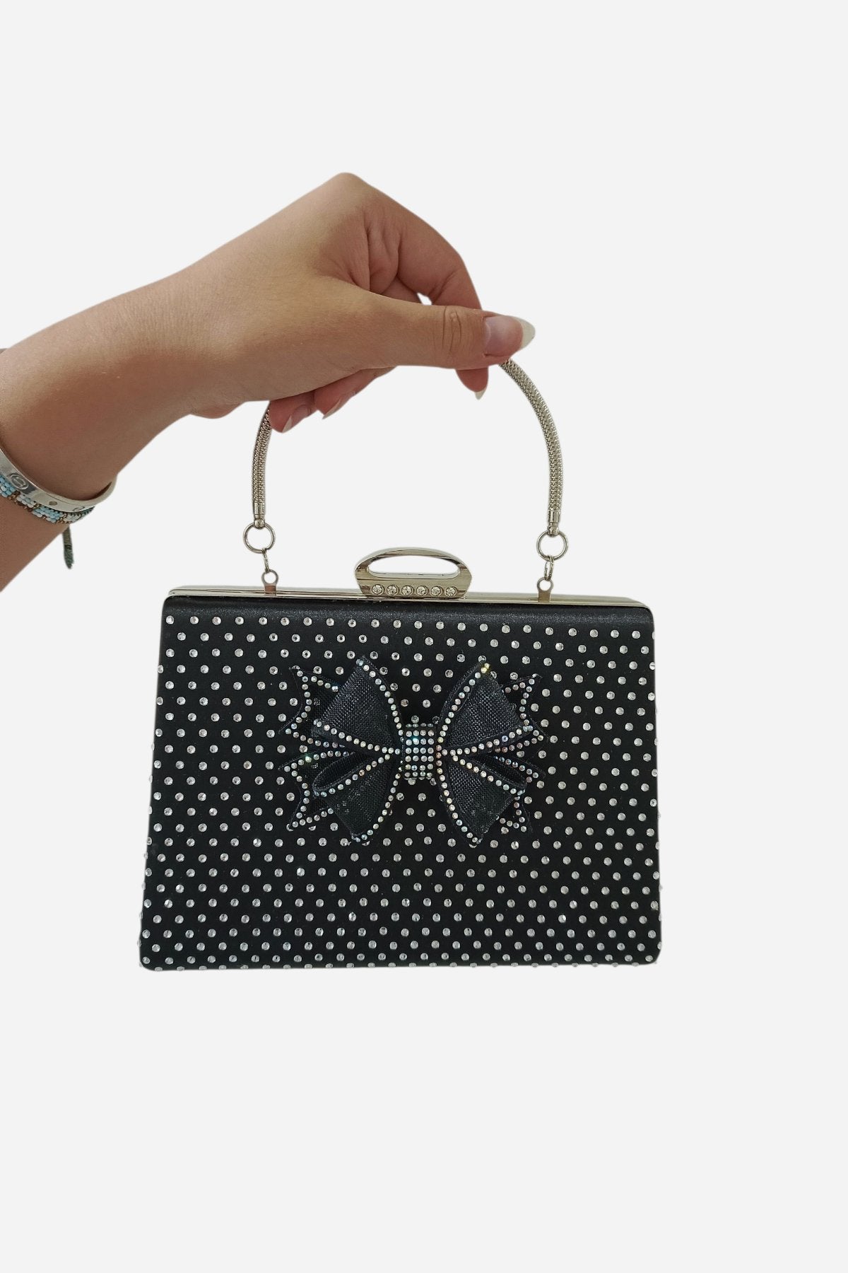 Schwarze Abendclutch mit Schleife und Strasssteinen sowie Kettenriemen